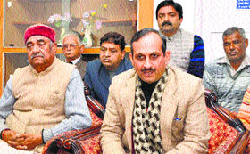 BJP state president Satpal Singh Satti addresses mediapersons at Una on Tuesday.