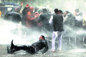 Police use water cannons on BJYM activists in Delhi.