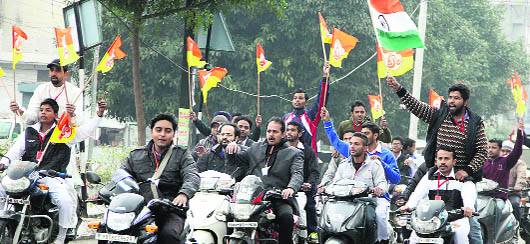 Youths hold a rally supporting Baba Ram Dev's presence in Jalandhar on Tuesday.