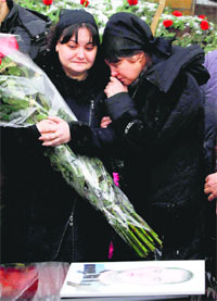 Relatives mourn during the funeral of a victim of an explosion in Volgograd on Tuesday. 