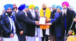 Bikram Singh Majithia being honoured by the SAD district president Upkar Singh Sandhu and councillors after the inauguration of the office in Amritsar on Wednesday. A tribune photo