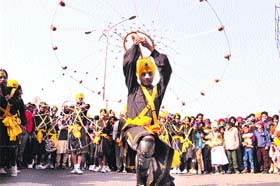 Religious fervour: Traditional Sikh warriors perform during a procession taken out to mark the birth anniversary of Guru Gobind Singh Ji in Bathinda on Wednesday