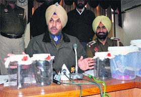 SSP Gurpreet Singh Bhullar shows weapons recovered from the accused in Bathinda on Wednesday