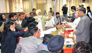 Congress and BJP councillors argue with the newly elected Mayor, HC Kalyan, over the declaration of a vote as invalid during the election to the post of Deputy Mayor of the Chandigarh Municipal Corporation on Wednesday. 
