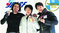 Manali-based snow runner Shiva Keshavan displays his silver medal won at the Asia Cup Deluge Championship, along with other winners, at Nagano in Japan. A file photograph