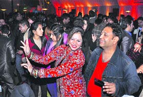 High spirit: A couple in a jubilant mood during a New Year party in Jalandhar on Tuesday