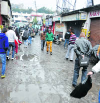 The pot-holed road to the inter-state bus terminal in Jammu. 