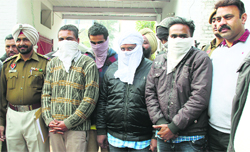 The accused in police custody in Ludhiana on Wednesday. Tribune photo: Himanshu Mahajan 