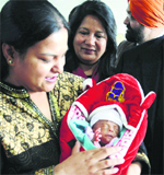 Naina in her mothers lap at the DMCH. Tribune photo: Himanshu Mahajan 