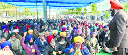 Harbans Singh Mundi, president, PAU Employees Front, addresses an election rally outside Thapar Hall on the PAU campus in Ludhiana on Wednesday. Photo: Inderjeet Verma
