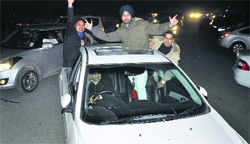 Residents ring in New Year at midnight in Ludhiana. Tribune Photo: Himanshu Mahajan