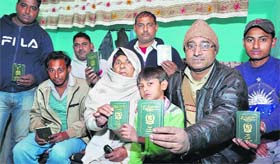 Hindu migrant families from Pakistan show their passports in Jalandhar on Wednesday