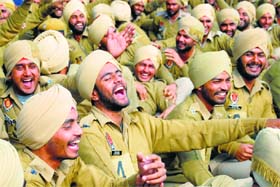 Policemen at a laughter session during yoga classes in Jalandhar on Wednesday. Yoga classes have been introduced in the police force for stress management