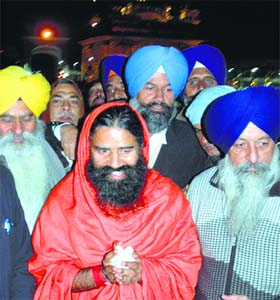 Faith beckons: Baba Ram Dev pays obeisance at the Golden Temple on the first day of the New Year in Amritsar
