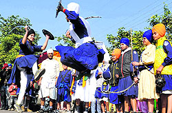 Youths perform gatka during a nagar kirtan organised in connection with the birth anniversary of Guru Gobind Singh in Sector 30, Chandigarh, on Thursday