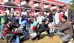 NSS volunteers of Panjab University, along with their teacher, stage a street play at a PU hostel on Thursday