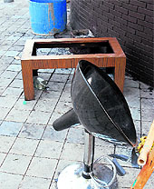 Damaged furniture and an empty bottle of liquor at the place where the firing incident took place in Sector 5, Panchkula