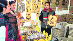Women visit a bamboo stall put by Assam artisans at Gandhi Shilp Bazaar on the 