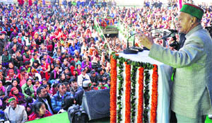 Chief Minister Virbhadra Singh addresses a gathering in Manali on Thursday. 