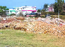 The proposed stadium ground has turned into a dumping site. 