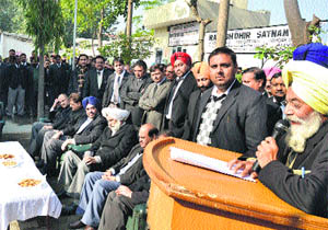 Judicial officials and DBA members celebrate New Year in Jalandhar on Thursday. 