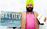 Human rights activist Kamaljeet Singh shows old nameplates of the District Hospital, Poonch, based on Dogra rulers names