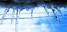 Icicles hang from a roof top