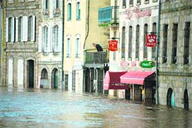 Submerged: A man looks at the flooded Quimperle city of France