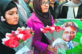 Prayers for speedy recovery: Supporters of Pakistan's former President Pervez Musharraf outside the Armed Forces Institute of Cardiology in Rawalpindi on Thursday