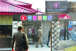 Police officials at the Five Degrees restaurant in Panchkula on Friday. Tribune photo