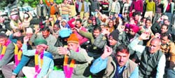 PUDA employees stage a protest in support of their demands in Mohali on Friday. Tribune photo: Parvesh Chauhan