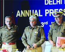 Delhi Police Commissioner B.S. Bassi (C) with senior officers after addressing an annual press conference in New Delhi on Friday.