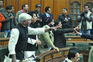 Congress MLAs shout during the ongoing session of the Delhi Vidhan Sabha on Friday. 
