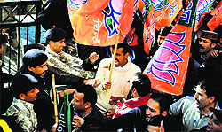 Activists of the Bharatiya Janata Yuva Morcha hold a protest to demand action against Chief Minister Virbhadra Singh in Shimla on Friday