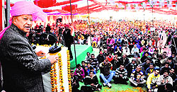 CM Virbhadra Singh addresses a public meeting at Daulatpur Chowk in the Gagret segment of Una district on Friday
