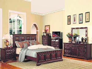 A bedroom with antique furniture. There is a huge market for quality reproduction pieces as everybody may not have money for the genuine antiques