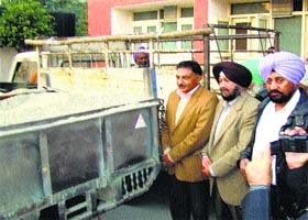 IG Border Range Chander Shekhar (left) watches reflectors being fixed behind vehicles in Amritsar