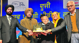 Organisers honour Aruna Shiv Kumar Batalvi during the Second World Punjabi Media Conference at the Punjab Kala Bhawan in Chandigarh on Saturday.