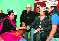 AAP workers meet victim Neera at her residence in Sector 26, Panchkula, on Sunday