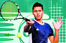 Eklavya Singh plays a shot during the ITF Junior-I Grade Tennis Tournament at the Chandigarh Lawn Tennis Association in Sector 10 on Sunday