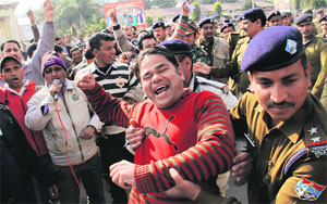 Unemployed TET and BEd passed youths being detained by the police in Dehradun on Saturday.