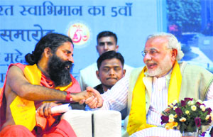 Narendra Modi and Yog guru Ramdev at the 5th foundation day celebrations of Bharat Swabhiman in New Delhi on Sunday.