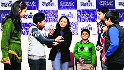 Children enact a short play on the concluding day of the Natrang's children theatre workshop in Jammu on Sunday