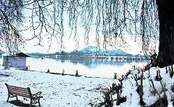 A view of the Nageen lake after snowfall in Srinagar on Sunday