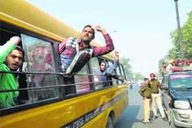Protest at CMs event: The police bundles employees of unaided schools into a bus in Bathinda on Sunday