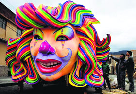 Craftsmen put the finishing touches to a float for the"White Day" parade, part of the Blacks and Whites' Carnival in Pasto, Colombia.