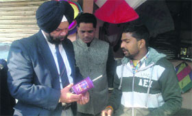 HS Gill, nayab tehsildar, inspects Chinese kite string in Amritsar.