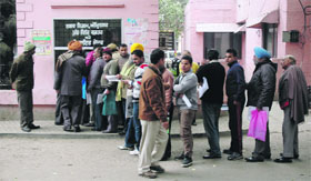 Residents queue up during a property tax camp at the Town Hall in Amritsar on Tuesday.