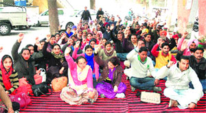 ETT teachers stage a dharna at the Zila Parishad office in Bathinda on Monday.