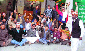 Safai karamcharis hold a protest outside the MCB office in Bathinda on Monday. 